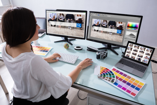 A Business Woman Working As A Web Designer In An Office.