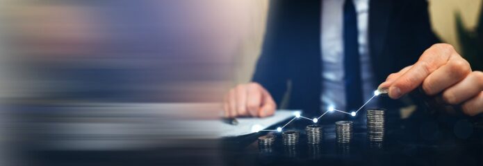 Coins were arranged on a table in a growing pattern. In the end, a businessman places the last coin at the top.